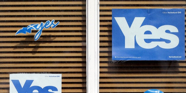 A Yes poster displayed a house window in East Barnes, Scotland, Tuesday, Sept. 16, 2014. The two sides in Scotland's independ