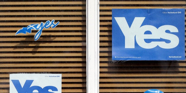 A Yes poster displayed a house window in East Barnes, Scotland, Tuesday, Sept. 16, 2014. The two sides in Scotland's independence debate are scrambling to convert undecided voters, with just two days to go until a referendum on separation. Anti-independence campaigners are pushing home their message that a "No" vote doesn't mean the status quo. The three main British political parties are promising Scotland greater powers, including tax-raising authority, if it remains part of the United Kingdom. The Yes campaign says the promises are vague and reveal the No side's desperation, with polls suggesting the outcome will be close. Scottish Deputy First Minister Nicola Sturgeon said "the only way to guarantee the real powers we need in Scotland is to vote Yes." (AP Photo/Scott Heppell)