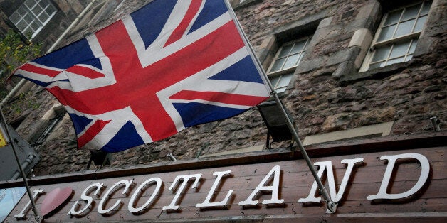 EDINBURGH, SCOTLAND - SEPTEMBER 19: The Union Flag flies above a gift shop in central Edinburgh on September 19, 2014 in Edi
