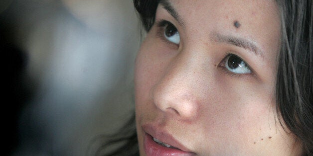Zeng Jinyan, the wife of high-profile Chinese AIDS campaigner Hu Jia who has been missing for more than a month, readies to m