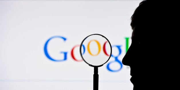 BERLIN, GERMANY - JUNE 02: A silhouette of a man and a magnifying glass is seen in front of a screen on which the Google search engine is displayed on June 02, 2014 in Berlin, Germany.(Photo by Michael Gottschalk/Photothek via Getty Images)