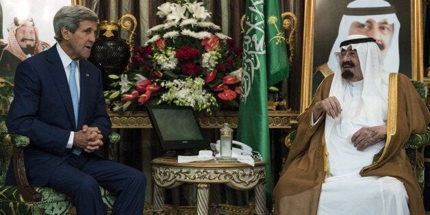 Saudi King Abdullah bin Abdul Aziz al-Saud (R) and US Secretary of State John Kerry talk before a meeting at the Royal Palace on September 11, 2014 in Jeddah, Saudi Arabia. Kerry and regional counterparts began talks today in Saudi Arabia on forming a coalition to support an American campaign against Islamic State jihadists in Syria and Iraq. AFP PHOTO/POOL/BRENDAN SMIALOWSKI (Photo credit should read BRENDAN SMIALOWSKI/AFP/Getty Images)