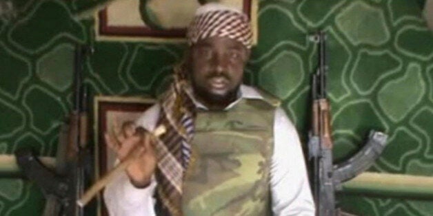 FILE - This file image made available Wednesday, Jan. 10, 2012, taken from video posted by Boko Haram sympathizers, shows the leader of the radical Islamist sect Imam Abubakar Shekau. Boko Haram has claimed responsibility for the April 15, 2014, mass abduction of nearly 300 teenage schoolgirls in northeast Nigeria. Even before the kidnapping, the U.S. government was offering up to a $7 million reward for information leading to the arrest of Shekau, whom the U.S. has labeled a specially designated global terrorist. (AP Photo/File)