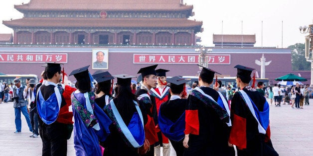 BEIJING, CHINA - 2014/06/19: Graduates from Peking Union Medical College take commemorative photos in Tienanmen Square. In 20