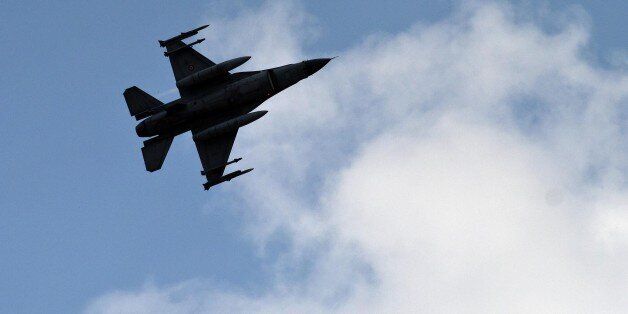 FILE - In this file photo taken Saturday, Aug. 31, 2013, a Turkish fighter jet flies above the Incirlik airbase, southern Turkey. Turkish fighter jets shot down a Syrian warplane after it violated Turkey's airspace Sunday, March 23, 2014, Turkish Prime Minister Recep Tayyip Erdogan said, in a move likely to ramp up tensions between the two countries already deeply at odds over Syria's civil war. (AP Photo/Vadim Ghirda, File)