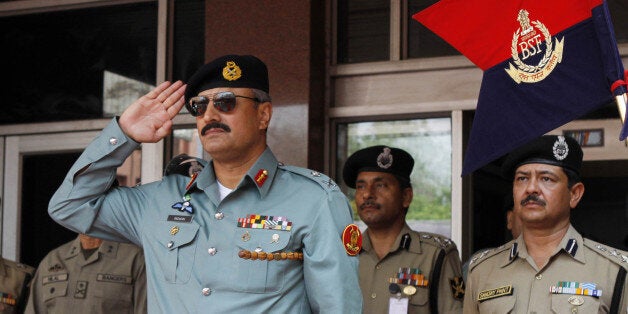 NEW DELHI, INDIA - JULY 2: Director General of Pakistani Rangers (Sindh) Major General Rizwan Akhtar salutes during a guard of honor prior to BSF-Pakistan Rangers bi-annual meeting 2012 on July 2, 2012 in New Delhi, India. Maj Gen Rizwan Akhtar is leading 18-member high-level delegation of Pakistan Rangers and Interior Ministry on 5-day border level talks with BSF. (Photo by Sunil Saxena /Hindustan Times via Getty Images)