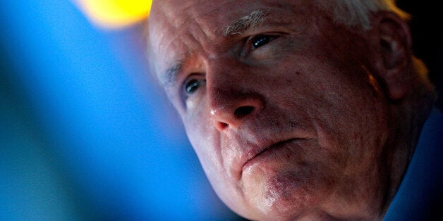 COVINGTON, LA - OCTOBER 13: U.S. Senator John McCain (R-AZ) (2nd L) speaks to members of the media before a Veterans rally at the American Legion Post on October 13, 2014 in Covington, Louisiana. Cassidy is running against incumbent U.S. Sen. Mary Landrieu (D-LA). (Photo by Sean Gardner/Getty Images)