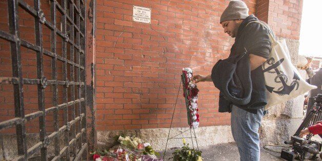  A man adds a rosary to a memorial at the John Weir Foote V.C. Armouries in Hamilton, Ontario, October 22, 2014 after a soldier believed to be from the base was killed in the attack in Ottawa. A gunman whose name was on a terror watch list killed a soldier and attempted to storm Canada's parliament before being gunned down in turn by the assembly's sergeant-at-arms. AFP PHOTO / Geoff ROBINS (Photo credit should read GEOFF ROBINS/AFP/Getty Images)