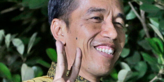 Indonesian President-elect Joko Widodo gestures during a press conference at his residence in Jakarta, Indonesia, Thursday, Aug. 21, 2014. Indonesia's top court on Thursday rejected an appeal by losing presidential candidate Joko Widodo in last month's presidential election over alleged voting irregularities, removing any lingering uncertainty around the victory of Jakarta Gov. Joko Widodo. (AP Photo/Dita Alangkara)