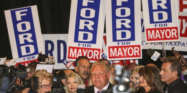 TORONTO, ON- OCTOBER 27 Doug Ford smiles as he thanks his supporter from the podium surrounded by his family at the Woodbine Banquet Hall in Toronto. October 27, 2014. (David Cooper/Toronto Star via Getty Images)