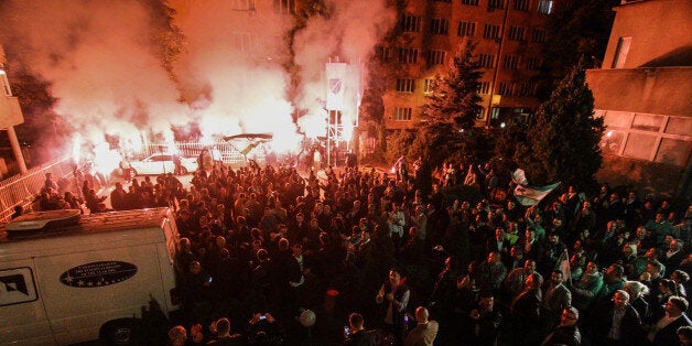 SARAJEVO, BOSNIA AND HERZEGOVINA - OCTOBER 12: Bosnian people celebrate the victory of Candidate and Deputy Chairman of conservative Party of Democratic Action, Bakir Izetbegovic, in Bosnian presidential elections in Sarajevo, Bosnia and Herzegovina, on October 13, 2014. (Photo by Samir Yordamovic/Anadolu Agency/Getty Images)