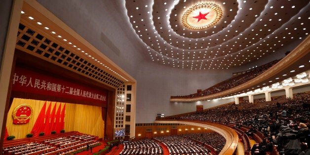 Zhou Qiang, head of the Supreme Peopleâs Court, delivers the Supreme Peopleâs Court work report during the third plenary session of the National People's Congress (NPC) at Great Hall of the People in Beijing, China, Monday, March 10, 2014. (AP Photo/Vincent Thian)