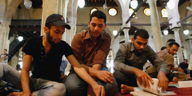 CAIRO, EGYPT - JUNE 02: Islamic students study in the al Azhar mosque before heading into exams at the associated al Azhar University, the chief centre of Arabic literature and Sunni Islamic learning in the world, on June 2, 2009 in Cairo, Egypt. The Egyptian capital is preparing to receive US President Barack Obama, who is due to deliver his Middle East policy speech at Cairo University this Thursday. (Photo by David Silverman/Getty Images)