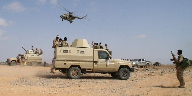 Yemeni troops they take part in an offensive against extremists in the southern province of Shabwa, on May 7, 2014. The offensive began on April 29 in Yemen's rugged southern and central provinces, where a wave of US drone strikes killed scores of suspected Al-Qaeda militants last month. Several foreigners suspected of membership in the network have been killed in the offensive, with authorities also speaking of Afghans, Somalis and Chechens. AFP PHOTO/STR (Photo credit should read STR/AFP/Getty Images)