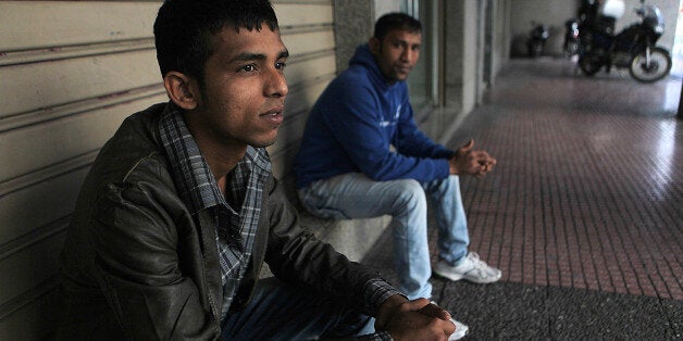 ATHENS, GREECE - OCTOBER 21: Immigrants who migrated to Greece for a better life face with economic crisis and the attacks of nationalist groups and they struggle for life by working on the streets in Athens, Greece on October 21, 2014. (Photo by Ayhan Mehmet/Anadolu Agency/Getty Images)