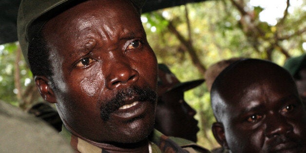 A picture taken on November 12, 2006 of then leader of the Lord's Resistance Army (LRA) Joseph Kony answering journalists' questions at Ri-Kwamba, in Southern Sudan. A former child soldier at the heart of a viral campaign to bring accused Ugandan war criminal Joseph Kony to justice said on March 9, 2012 he backed the video and urged people to watch it. 'It's a hard movie,' Jacob Acaye told ABC News about the 30-minute video that has garnered nearly 58 million viewers since Monday. AFP PHOTO/ POOL - STUART PRICE (Photo credit should read STUART PRICE/AFP/Getty Images)