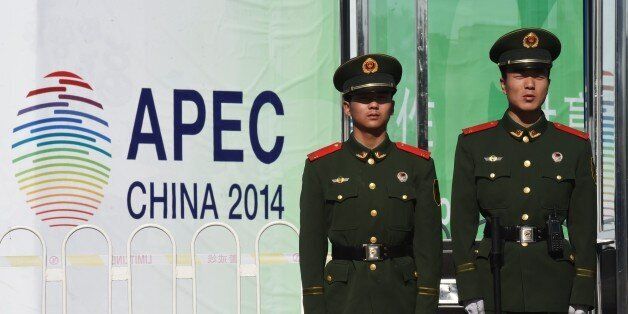 Paramilitary policemen stand guard outside the Asia-Pacific Economic Cooperation (APEC) summit venue in Beijing on November 6, 2014. Leaders of more than half the world's economy gather in Beijing over the next week for the annual APEC forum, with China and the US pushing rival trade agreements as the week-long series of international summits gets under way. AFP PHOTO/Greg BAKER (Photo credit should read GREG BAKER/AFP/Getty Images)