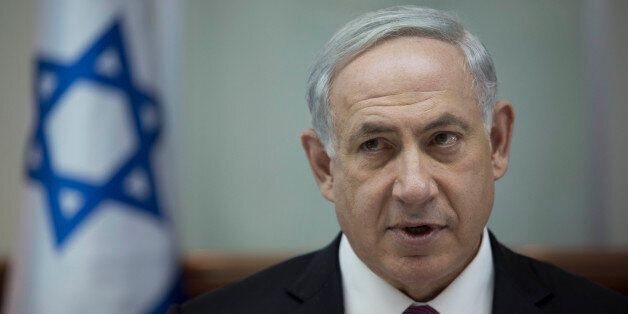 Israel's Prime Minister Benjamin Netanyahu chairs the weekly cabinet meeting in Jerusalem, Sunday, Oct. 26, 2014. (AP Photo/Abir Sultan, Pool)