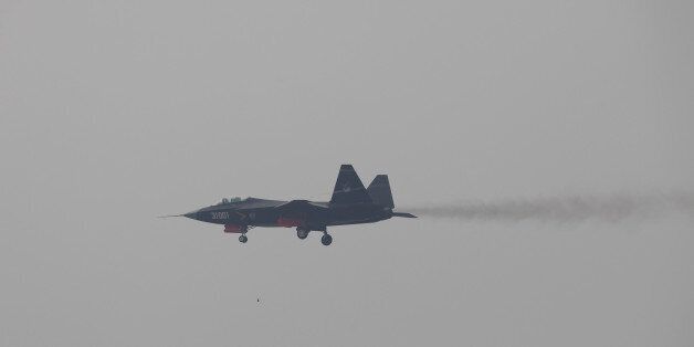 ZHUHAI, CHINA - NOVEMBER 10: A J-31 stealth fighter of Chinese People's Liberation Army Air Force is seen during a test flight ahead of the Airshow China 2014 in Zhuhai, Guangdong province, November 10, 2014. Airshow China is the only international aerospace trade show in China that is endorsed by the Chinese central government since 1996. It features the display of real-size products, trade talks, technological exchange and flying display. (Photo by Aleksandar Plavevski/Anadolu Agency/Getty Images)