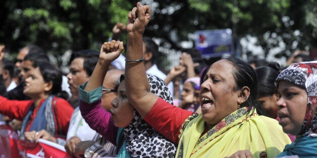 DHAKA, BANGLADESH - 2014/10/24: Injured Rana Plazas Garment workers protest and form human chain in front of press club in Dhaka asking for their medical allowance from their employer which collapse one and half year had pass. (Photo by Mohammad Asad/Pacific Press/LightRocket via Getty Images)