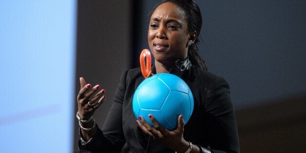 Uncharted Play founder and CEO Jessica Matthews shows her company's invention, Soccket, a soccer ball that generates electricity for an attachable reading lamp, at the Forbes Under 30 Summit in Philadelphia on October 21, 2014. AFP PHOTO/Nicholas KAMM (Photo credit should read NICHOLAS KAMM/AFP/Getty Images)