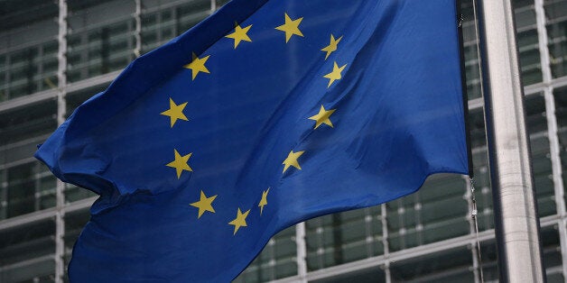 BRUSSELS, BELGIUM - OCTOBER 24: European Union flags are pictured outside the European Commission building on October 24, 2014 in Brussels, Belgium. Alongside criticism from outgoing European Commission president Jose Manuel Barroso on the UK's stance on EU immigration and a plan to quit the European Court of Human Rights, the UK has now been told to pay an extra Â£1.7bn GBP (2.1bn EUR) towards the EU's budget because its economy has performed better than expected. (Photo by Carl Court/Getty Images)