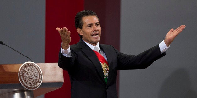 Mexico's President Enrique Pena Nieto gives his second state-of-the-nation address inside the National Palace in Mexico City, Tuesday, Sept. 2, 2014. (AP Photo/Eduardo Verdugo)