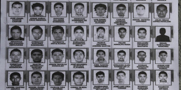 A poster seen at a demonstration at the Angel of Independence, shows images of the 43 disappeared rural college students, in