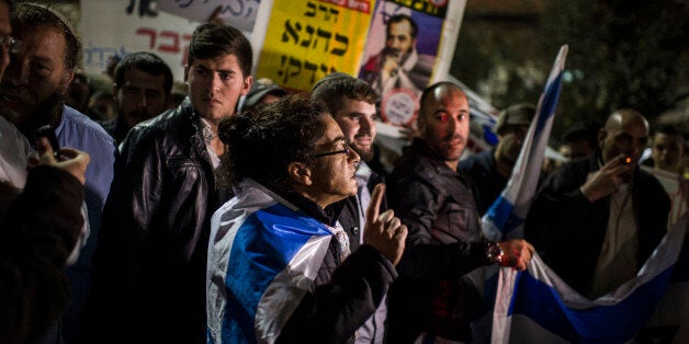 JERUSALEM, ISRAEL - NOVEMBER 18: Right-wing activists protest on November 18, 2014 in Jerusalem, Israel. The right-wing demonstrators were protesting against the Muslim population in Israel, following this morning's terror attack at a synagogue in the western Jerusalem neighbourhood of Har Nof. (Photo by Ilia Yefimovich/Getty Images)