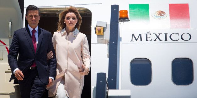 BRISBANE, AUSTRALIA - NOVEMBER 14: In this handout photo provided by the G20 Australia, Mexico's President Enrique Pena Nieto and First Lady Angelica Rivera Hurtado arrive at G20 Terminal on November 14, 2014 in Brisbane, Australia. World leaders have gathered in Brisbane for the annual G20 Summit and are expected to discuss economic growth, free trade and climate change as well as pressing issues including the situation in Ukraine and the Ebola crisis. (Photo by Patrick Hamilton/G20 Australia via Getty Images)