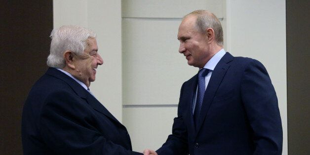 SOCHI, RUSSIA- NOVEMBER 26: Russian President Vladimir Putin greets Syrian Foreign Minister Walid Muallem in Bocharov Ruchey State Residence on November 26, 2014 in in Sochi, Russia. Foreign Minister of Syria is on a one-day visit to Russia. (Photo by Sasha Mordovets/Getty Images)