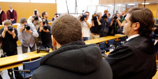German Kreshnik B. , left, waits for the beginning of his trial at a higher regional court in Frankfurt, Germany, Monday, Se