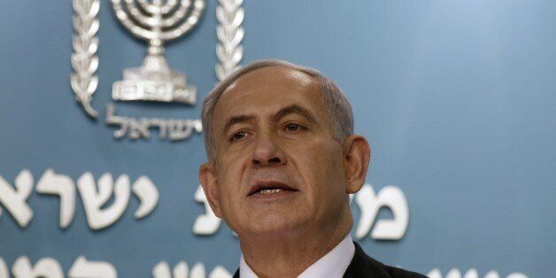 Israeli Prime Minister Benjamin Netanyahu gestures during a press conference in Jerusalem on December 2, 2014. Netanyahu called today for early elections as he fired two key ministers in his coalition for opposing government policy. The sackings were the latest move in a political crisis that will come to a head tomorrow when lawmakers vote on a bill to dissolve the parliament, or Knesset. AFP PHOTO/POOL/GALI TIBBON (Photo credit should read GALI TIBBON/AFP/Getty Images)