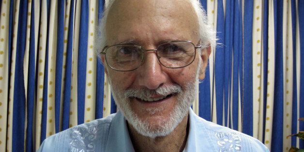 FILE - In this Nov. 27, 2012 file photo provided by James L. Berenthal, shows jailed American Alan Gross poses for a photo during a visit by Rabbi Elie Abadie and U.S. lawyer James L. Berenthal at Finlay military hospital as he serves a prison sentence in Havana, Cuba. The mother of an American man who was imprisoned in Cuba while working to set up Internet access there has died. The family of 92-year-old Evelyn Gross said Wednesday that she died in Plano, Texas. She had suffered from lung cancer. Grossâ son Alan Gross was arrested in Cuba in 2009. The Maryland man had been working covertly in Cuba as a subcontractor for the U.S. government's U.S. Agency for International Development. (AP Photo/James L. Berenthal, File)