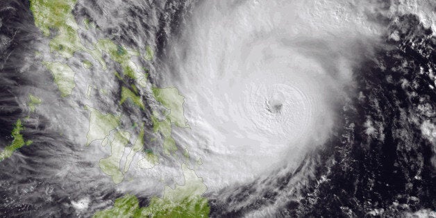 This image made available by the National Oceanic and Atmospheric Administration (NOAA) shows Typhoon Hagupit on Friday, Dec.