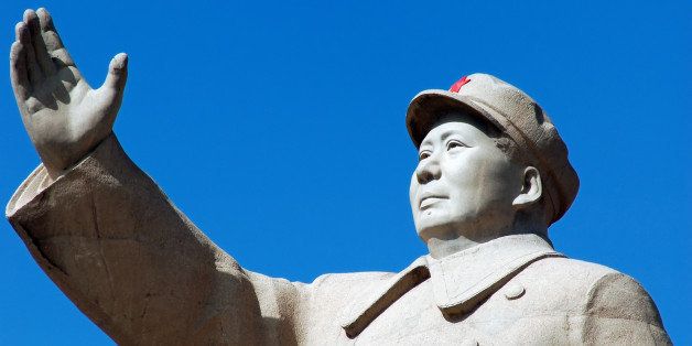 a statue of china's former...