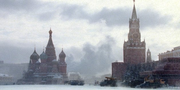 A heavy snow falls on Moscow's Red Square Tuesday, Feb. 2, 1999. The forecast for tonight is - 20 C ( - 4 F ). St. Basil's Cathedral, left, and Kremlin Spassky Tower, far right, and mausoleum of Lenin, right, are in the background. (AP Photo/ Alexander Zemlianichenko)