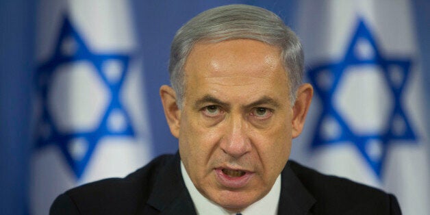 Israeli Prime Minister Benjamin Netanyahu speaks to the media during a press conference at the defense ministry in Tel Aviv, Israel, Saturday Aug. 2, 2014. Netanyahu warned Hamas on Saturday that it will "pay an intolerable price" if it continues to fire rockets at Israel, but also hinted that Israel would reassess its Gaza operation once troops have demolished Hamas military tunnels under the Gaza-Israel border. (AP Photo/Oded Balilty)