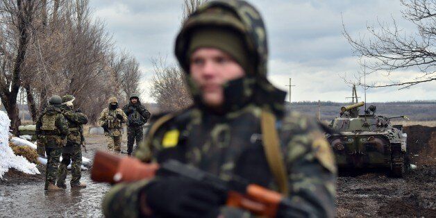 Ukrainian soldiers man the frontline outside the eastern Ukrainian city of Debaltseve, Donetsk region, on December 24,2014. A new round of talks aimed at ending a protracted Moscow-backed separatist uprising in eastern Ukraine got underway in the Belarussian capital Minsk, a foreign ministry spokesman said. AFP PHOTO/ SERGEI SUPINSKY (Photo credit should read SERGEI SUPINSKY/AFP/Getty Images)