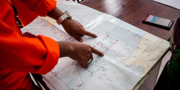 BELITUNG, INDONESIA - DECEMBER 29: Indonesian search and rescue team coordinating the search area on December 29, 2014 in Belitung, Indonesia. AirAsia announced that flight QZ8501 from Surabaya to Singapore, with 162 people on board, lost contact with air traffic control at 07:24 a.m. local time on December 28. (Photo by Oscar Siagian/Getty Images)