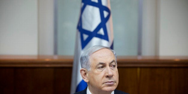 Israeli Prime Minister Benjamin Netanyahu attends a weekly cabinet meeting in Jerusalem, Sunday, Jan. 4, 2015. (AP Photo/Oded