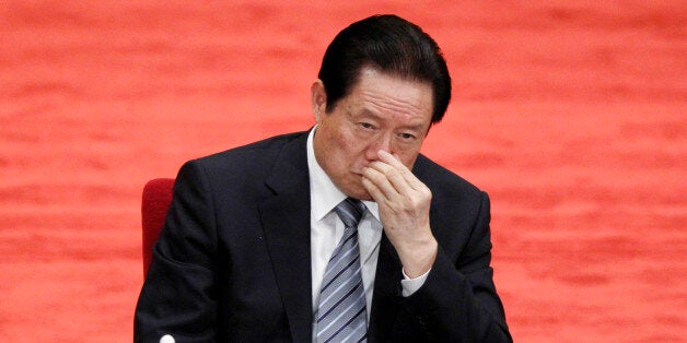 FILE - In this file photo taken May 4, 2012, Zhou Yongkang, Chinese Communist Party Politburo Standing Committee member in charge of security, attends a conference to celebrate the 90th anniversary of the founding of Chinese Communist Youth League at the Great Hall of the People in Beijing. The fate of the once-feared Zhou, 72, appeared to be sealed by the just-after-midnight announcements Saturday that he was expelled from China's ruling Communist Party and arrested in a criminal investigation into allegations ranging from bribe-taking to leaking state secrets. (AP Photo/Alexander F. Yuan, File)