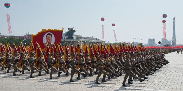 In a photo taken on July 27, 2013 North Korean soldiers march on Kim Il-Sung square during a military parade marking the 60th anniversary of the Korean war armistice in Pyongyang. North Korea mounted its largest ever military parade July 27 to mark the 60th anniversary of the armistice that ended fighting in the Korean War, displaying its long-range missiles at a ceremony presided over by leader Kim Jong-Un. AFP PHOTO / Ed Jones (Photo credit should read Ed Jones/AFP/Getty Images)