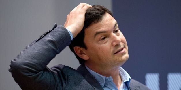 French economist Thomas Piketty speaks to students and guests during a presentation at King's College, central London, on April 30, 2014. Piketty said that he hoped to create a 'more informed fight' about the issue of income inequality as he launched his bestselling and highly controversial book in Britain. AFP PHOTO / LEON NEAL (Photo credit should read LEON NEAL/AFP/Getty Images)