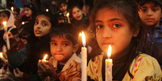 LAHORE, PUNJAB, PAKISTAN - 2014/12/23: Pakistani students of Study in School gather in a candlelight vigil for the massacre of the innocent school children at Peshawar school. (Photo by Rana Sajid Hussain/Pacific Press/LightRocket via Getty Images)