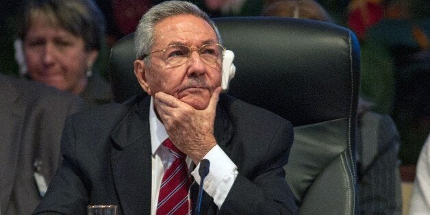 Cuban President Raul Castro listens during the opening of the Caribbean Community (CARICOM) Summit, in Havana, on December 8, 2014. The summit -- bringing together the 15 CARICOM member states and Cuba -- aims to increase trade and cooperation within the group and with Cuba. AFP PHOTO / YAMIL LAGE (Photo credit should read YAMIL LAGE/AFP/Getty Images)