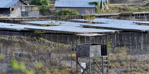 This photo made during an escorted visit and reviewed by the US military, shows the fenced enclosures at the abandoned 'Camp