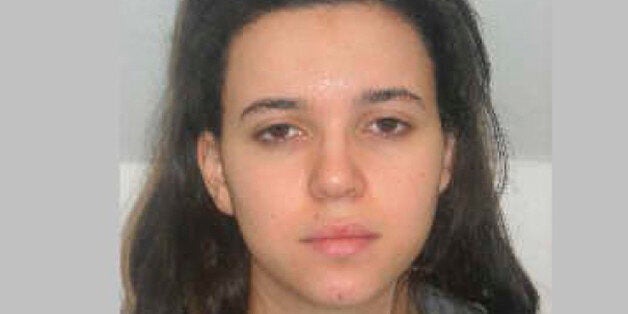 FILE - This photo provided by the Paris Police Prefecture Friday, Jan. 9, 2015 shows Hayat Boumedienne the suspect in the kosher market attack. Turkey's foreign minister said Monday Jan.12, 2015 that Boumedienne, wife of Amedy Coulibaly, one of the perpetrators of the terrorist rampage in France last week, crossed into Syria from Turkey on Jan. 8. (AP Photo/Prefecture de Police de Paris, File)