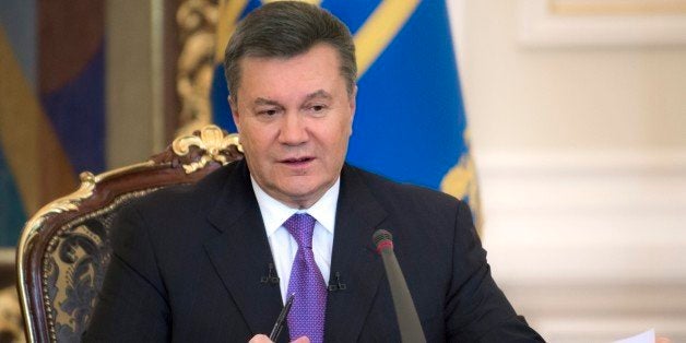 FILE - In this Thursday, Dec. 19, 2013 file photo Ukrainian President Viktor Yanukovych speaks during a press conference in