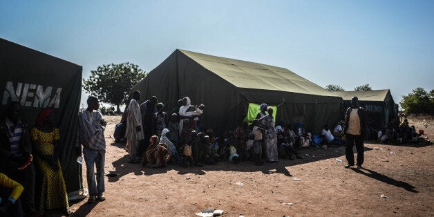 ADAMAWA, NIGERIA - DECEMBER 6: Nigerians fled their homes in Yobe, Borno states due to the clashes between Nigeria's militant group Boko Haram and army forces, hold on life at the National Youth Service Corps (NYSC) orientation camps in Damari, Adamawa state of Nigeria on December 6,2014. (Photo by Mohammed Elshamy/Anadolu Agency/Getty Images)